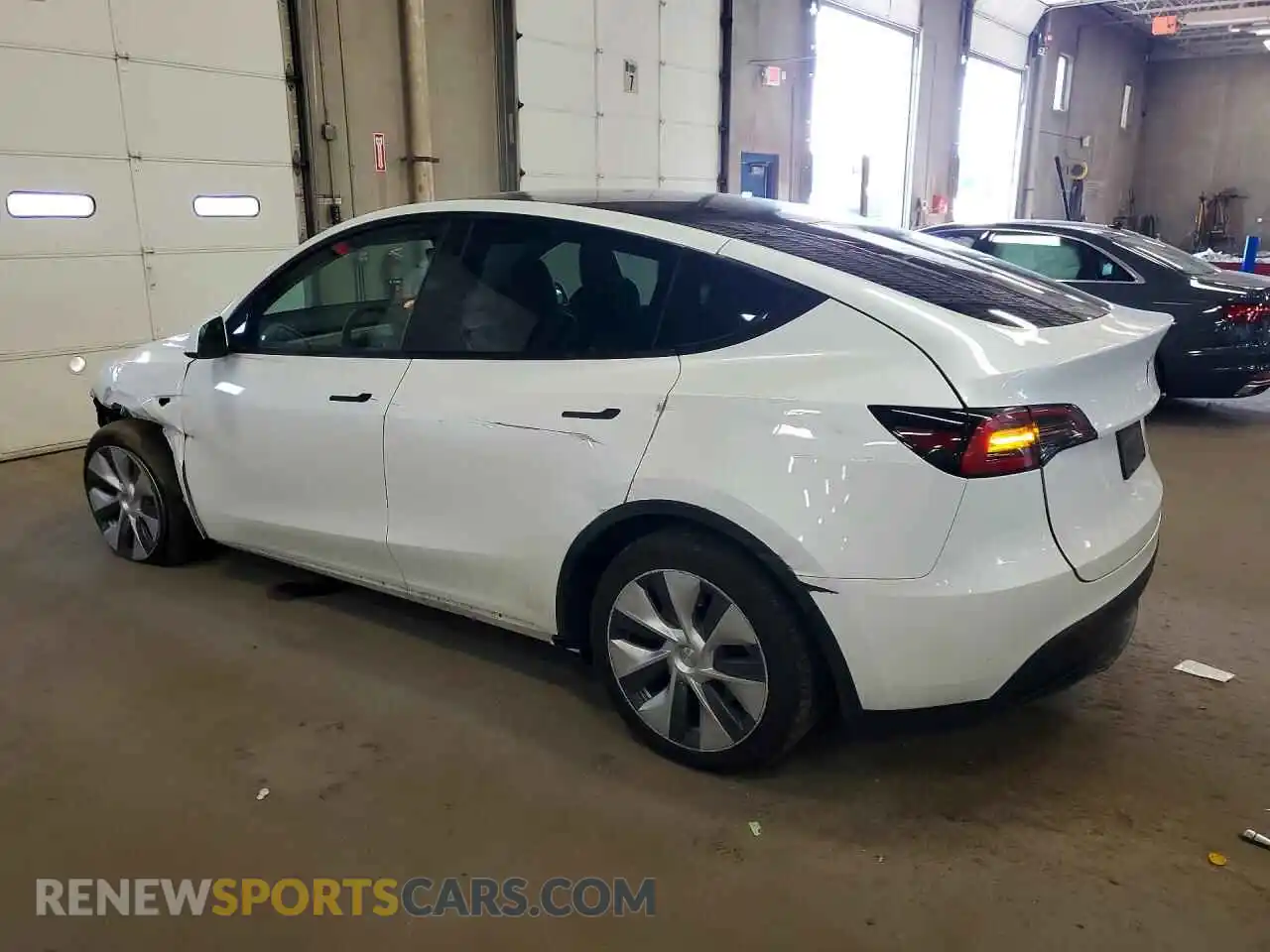 2 fotografías del automóvil dañado 7SAYGDEE6PA076103 TESLA MODEL Y 2023