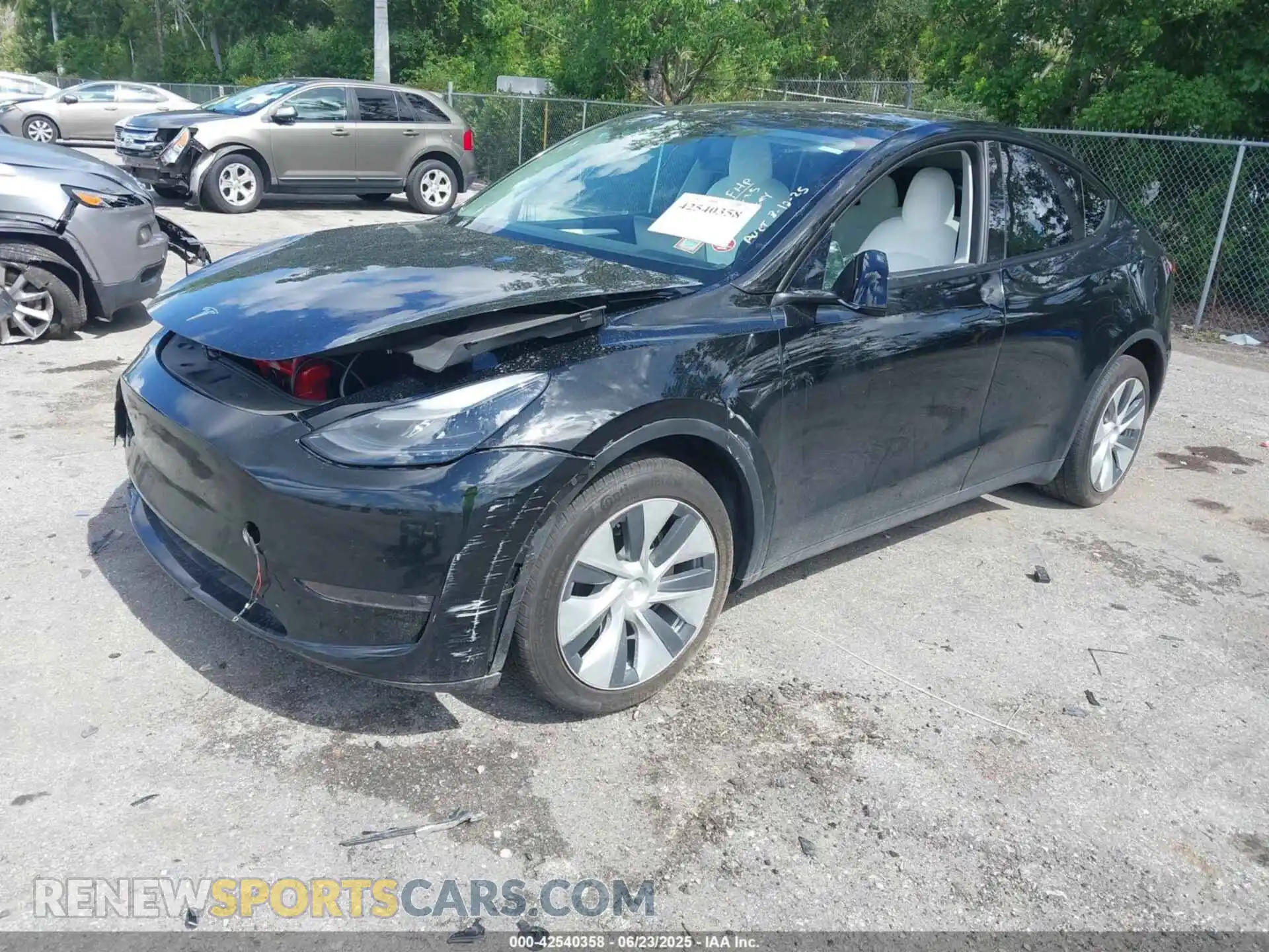 2 fotografías del automóvil dañado 7SAYGDEEXPF630116 TESLA MODEL Y 2023