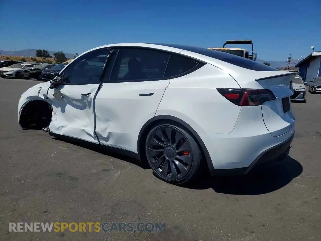 2 fotografías del automóvil dañado 7SAYGDEF2PF713869 TESLA MODEL Y 2023