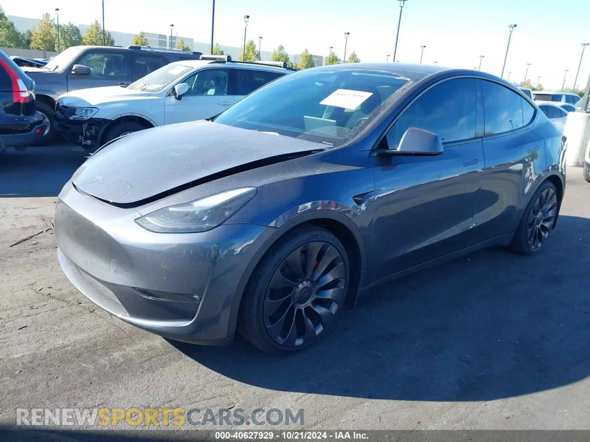 2 fotografías del automóvil dañado 7SAYGDEF2PF825426 TESLA MODEL Y 2023