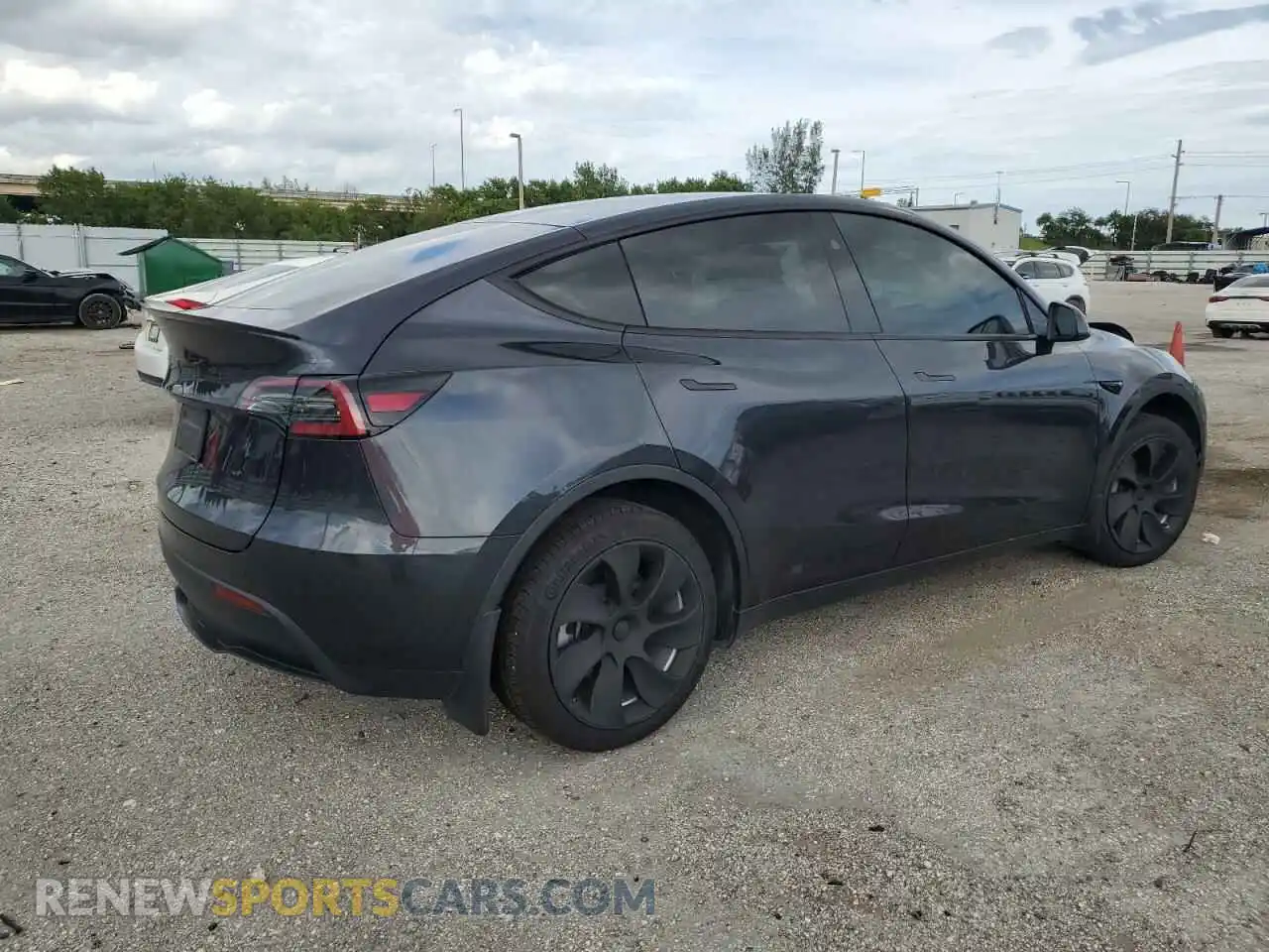 3 Photograph of a damaged car 7SAYGDED3RF056534 TESLA MODEL Y 2024