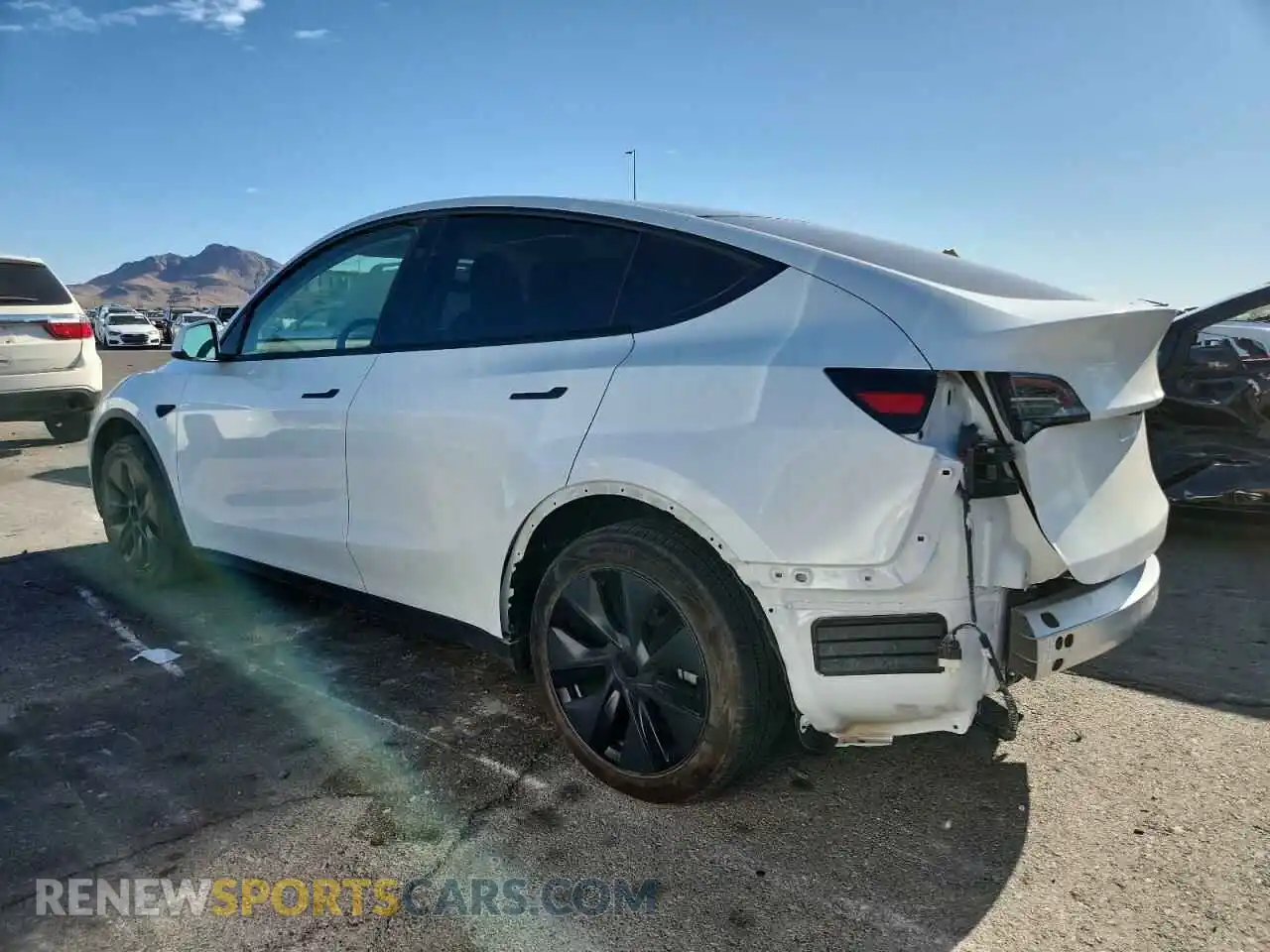 2 Photograph of a damaged car 7SAYGDED7RF130909 TESLA MODEL Y 2024