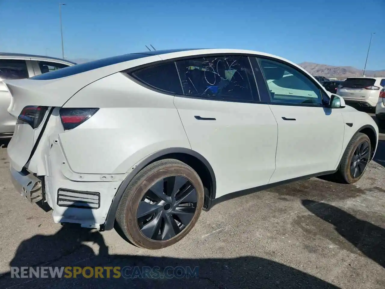 3 Photograph of a damaged car 7SAYGDED7RF130909 TESLA MODEL Y 2024