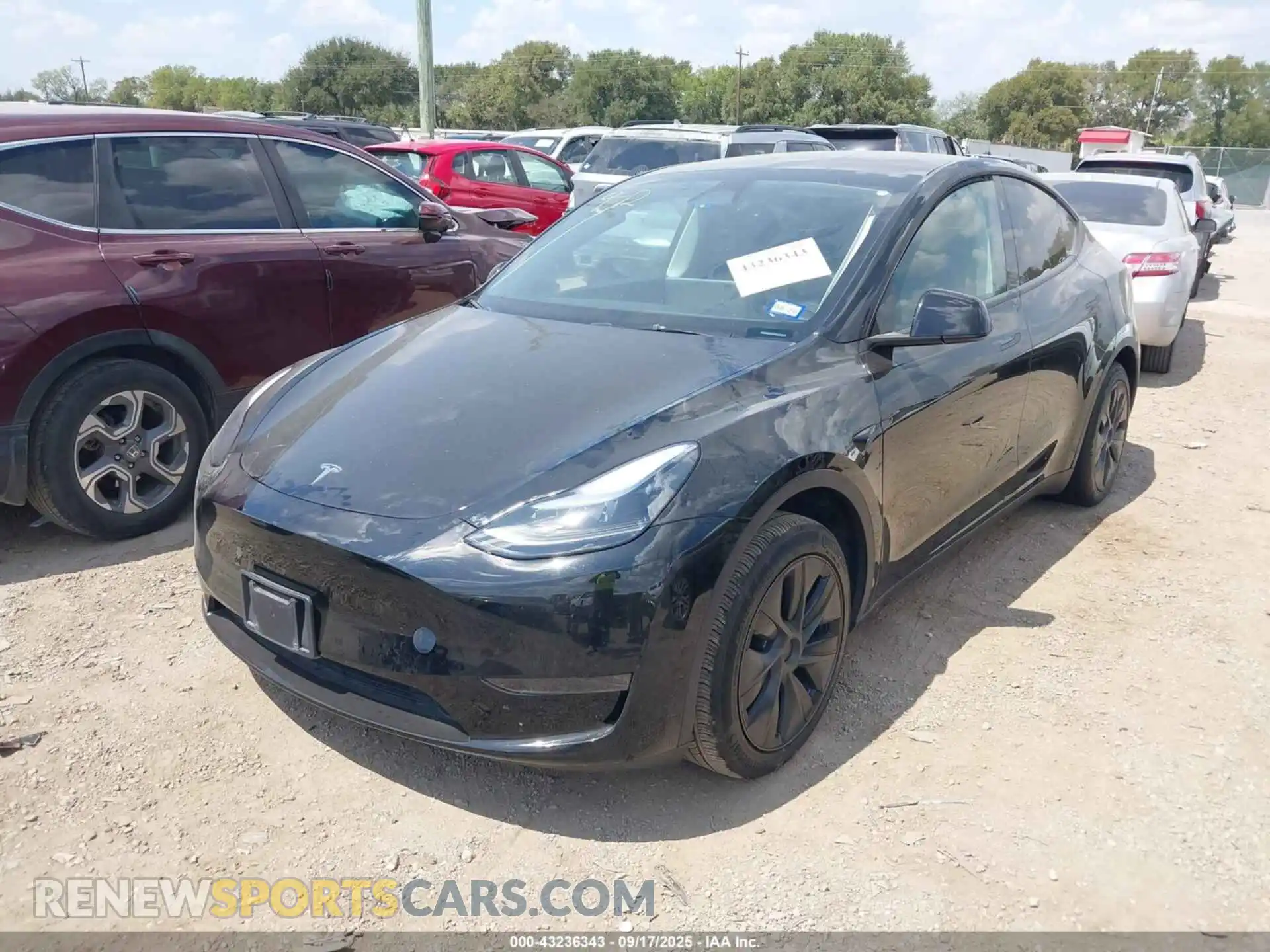 2 fotografías del automóvil dañado 7SAYGDED9RF104506 TESLA MODEL Y 2024