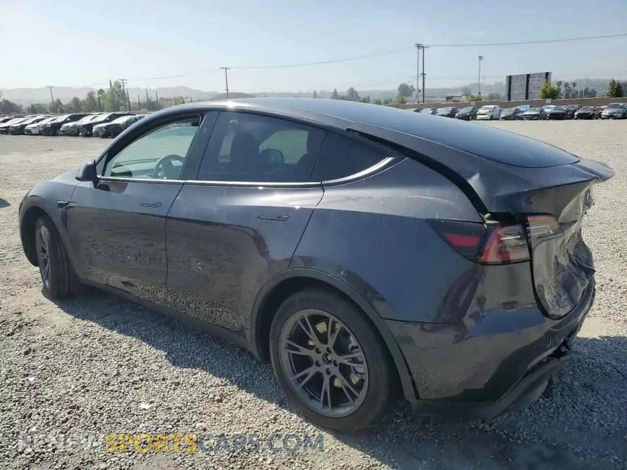 2 Photograph of a damaged car 7SAYGDEE3RF121102 TESLA MODEL Y 2024