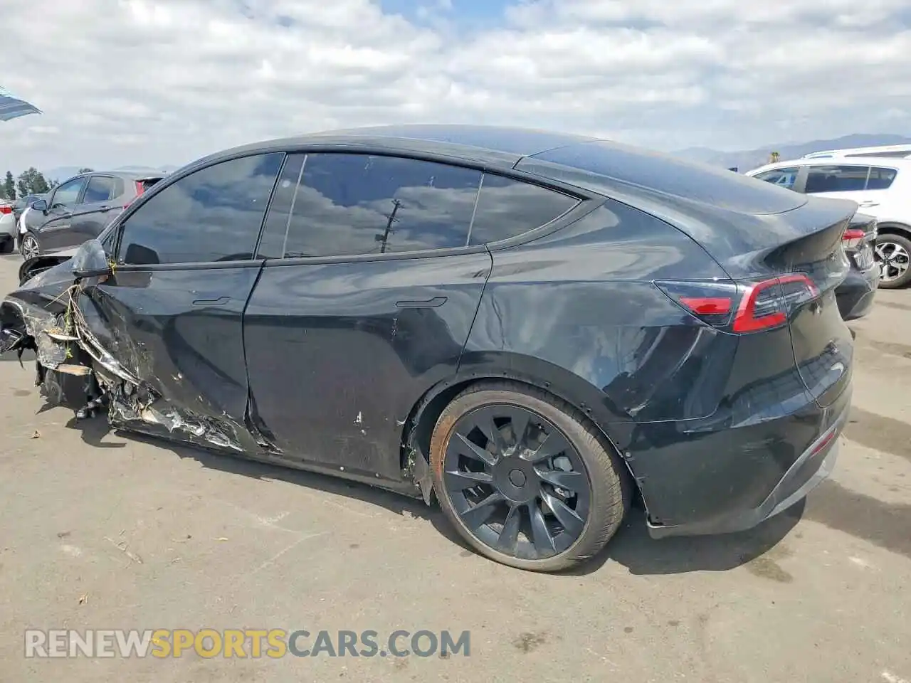 2 fotografías del automóvil dañado 7SAYGDED7SF219854 TESLA MODEL Y 2025